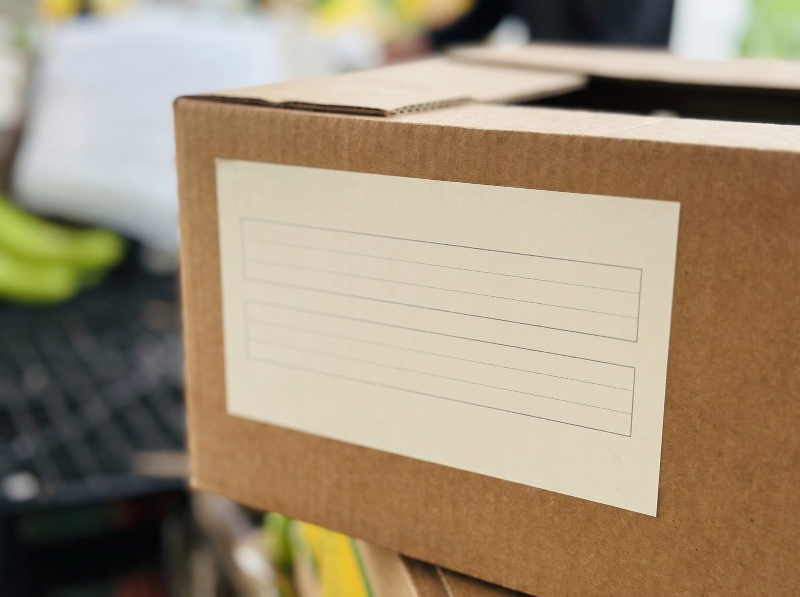 Close view of a blank ruled date panel printed on the side of a brown banana carton
